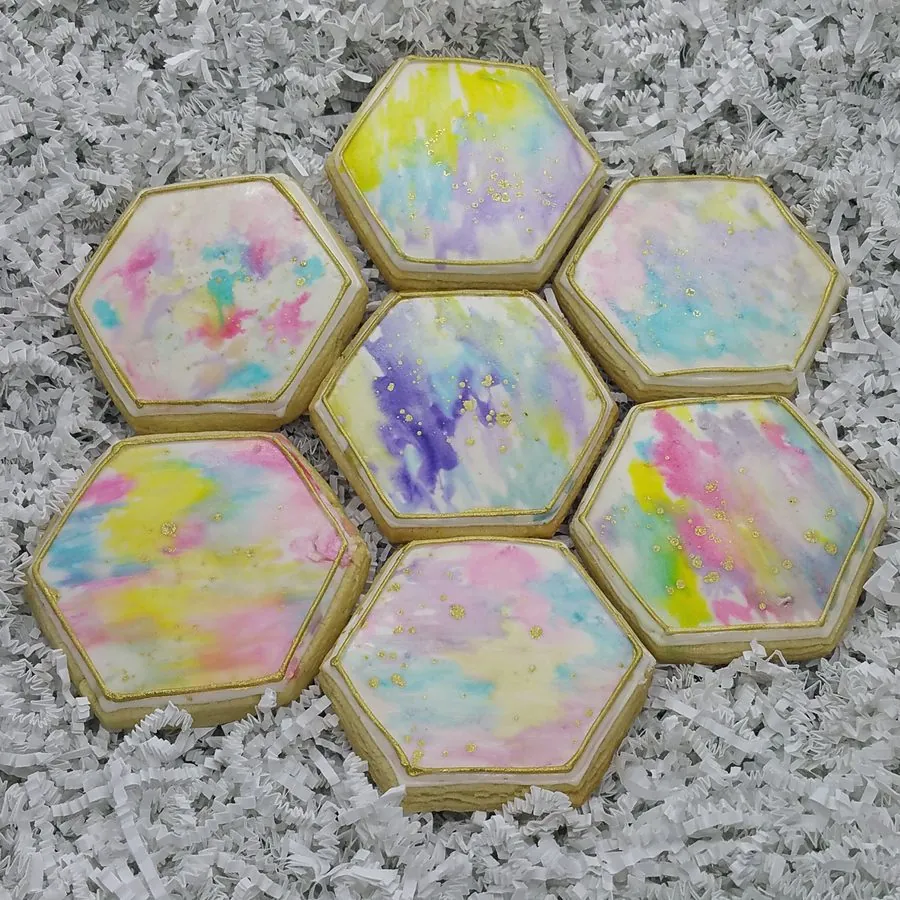 Hexagon cookies painted in soft watercolor with gold flecks